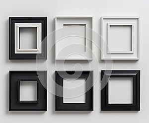 A collection of black and white picture frames arranged neatly against a white backdrop, showcasing a variety of sizes