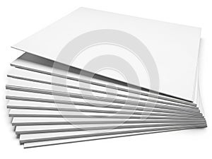 A collection of blank white and lined paper sheets arranged in a stack