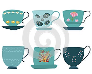Collection of blue retro tea cups with saucer and floral decor on white
