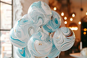 A collection of blue and white marbles arranged neatly in a vase, creating an interesting visual pattern, Marble patterned