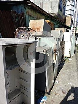 collection of broken and old refrigerators.