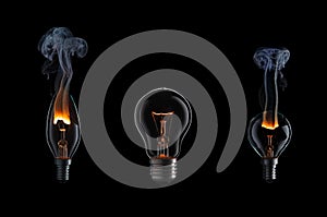 Collection of burning light bulbs