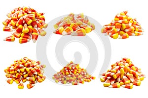 A collection of candy corn piles on a white background