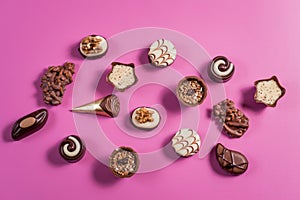 Collection of chocolate sweets on colorful background