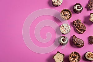 Collection of chocolate sweets on colorful background