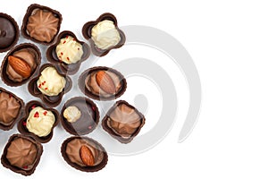 Collection of chocolates, top view. Various chocolate pralines isolated on white background