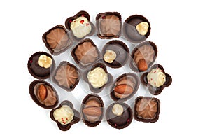 Collection of chocolates on a white background. Confectionery products, top view