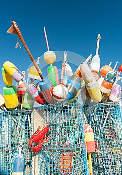 Collection of colorful fishing or lobster trap buoys and markers at wharf in Provincetown, Massachusetts, USA