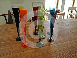 Collection of colorful glass vases on a table