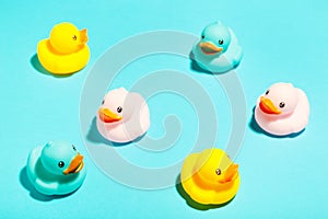 Collection of colorful rubber ducks on a blue background