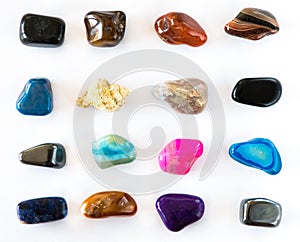 Collection of colorful semiprecious gemstones on white background