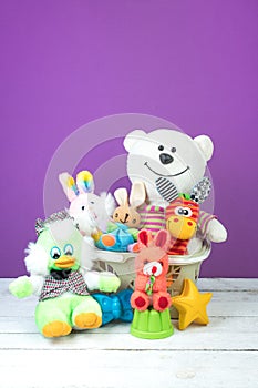 Collection of colorful toys on a purple background. Kids toys