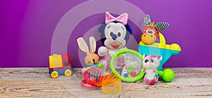 Collection of colorful toys on purple background. Kids toys