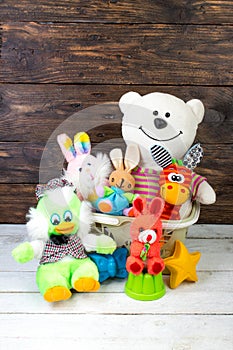 Collection of colorful toys on a wooden background. Kids toys