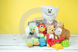 Collection of colorful toys on a yellow background. Kids toys