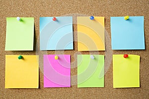 Collection of colorful variety post it. paper note reminder sticky notes pin on cork bulletin board Note reminder. empty space for