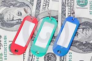 Collection of a colourful key fobs with dollars bills.
