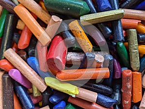 A collection of colourful old wax crayons