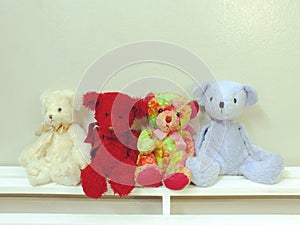 Collection of cute teddy bear on wooden background