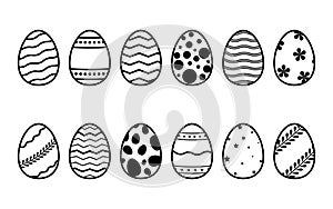 Collection of decorated Easter eggs in doodle style isolated on white background. Bundle of outlined icons with different