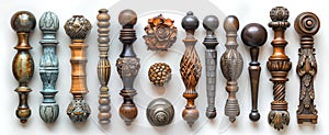 Collection of decorative furniture handles. Ornate metal knobs and pulls on white backdrop. Concept of cabinetry