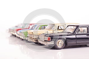 Collection of die-cast car models isolated on the white background