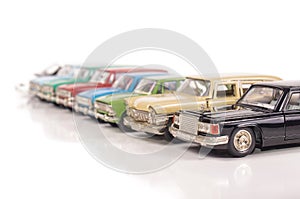 Collection of die-cast car models isolated on the white background
