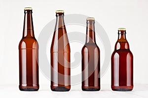 Collection different brown beer bottles, mockup.