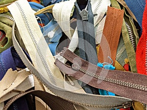 A collection of different coloured zips and zippers