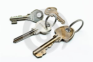 collection of different house keys isolated on white background