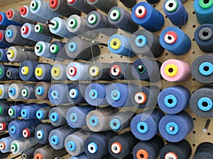 Collection of different klinds of blue sewing thread