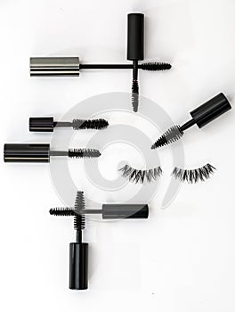 Collection of different mascara brushes on a white background.
