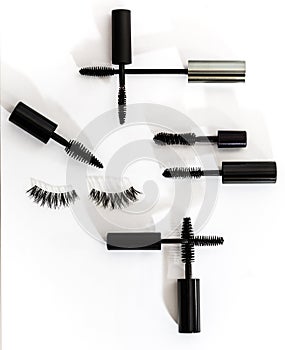 Collection of different mascara brushes on a white background.