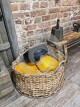 A collection of different types of cheese in a basket