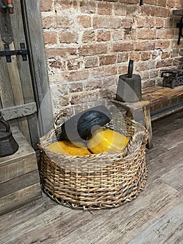 A collection of different types of cheese in a basket