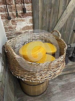 A collection of different types of cheese in a basket