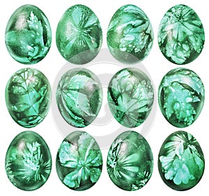 Collection Of Dozen Easter Eggs Dyed Emerald Green And Decorated With Weed Leaves Imprints Isolated On White Background