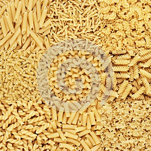 Collection of dry uncooked pasta texture background