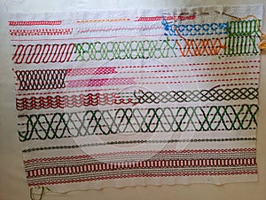 Collection of embroidery stitch patterns on a fabric,