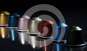 Espresso coffee pods isolated on black background, Closeup view with details, banner