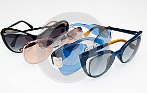 Collection of fashionable sunglasses on white