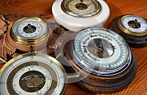 A collection of five different barometers determines weather forecasts based air pressure