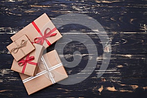 Collection of four different present boxes wrapped with ribbon