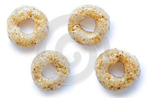 Collection of four honey cheerios isolated on white.