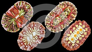 Collection of four traditional welcome garnished Appetizer savory dishes isolated on black background