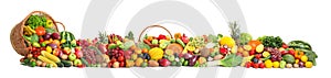 Collection of fresh organic vegetables and fruits on white background.