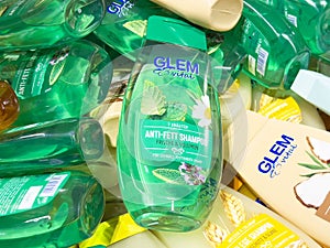 Collection of glem vital shampoo bottles with herbal and wheat designs