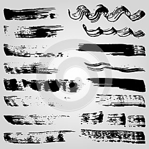Collection of grunge black ink banners and blots on white background