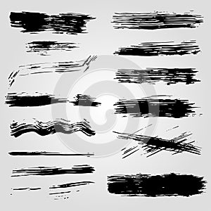 Collection of grunge black ink banners and blots on white background