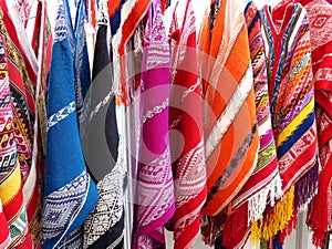 Collection of handicraft ponchos from Peru